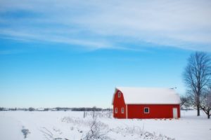 barn covered in snow